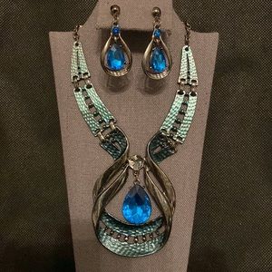 Blue acrylic stone layered in metal design necklace with matching earrings
